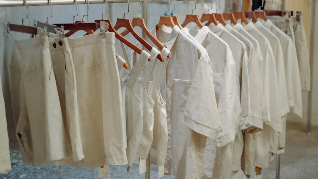 a bunch of pants hanging on a rack